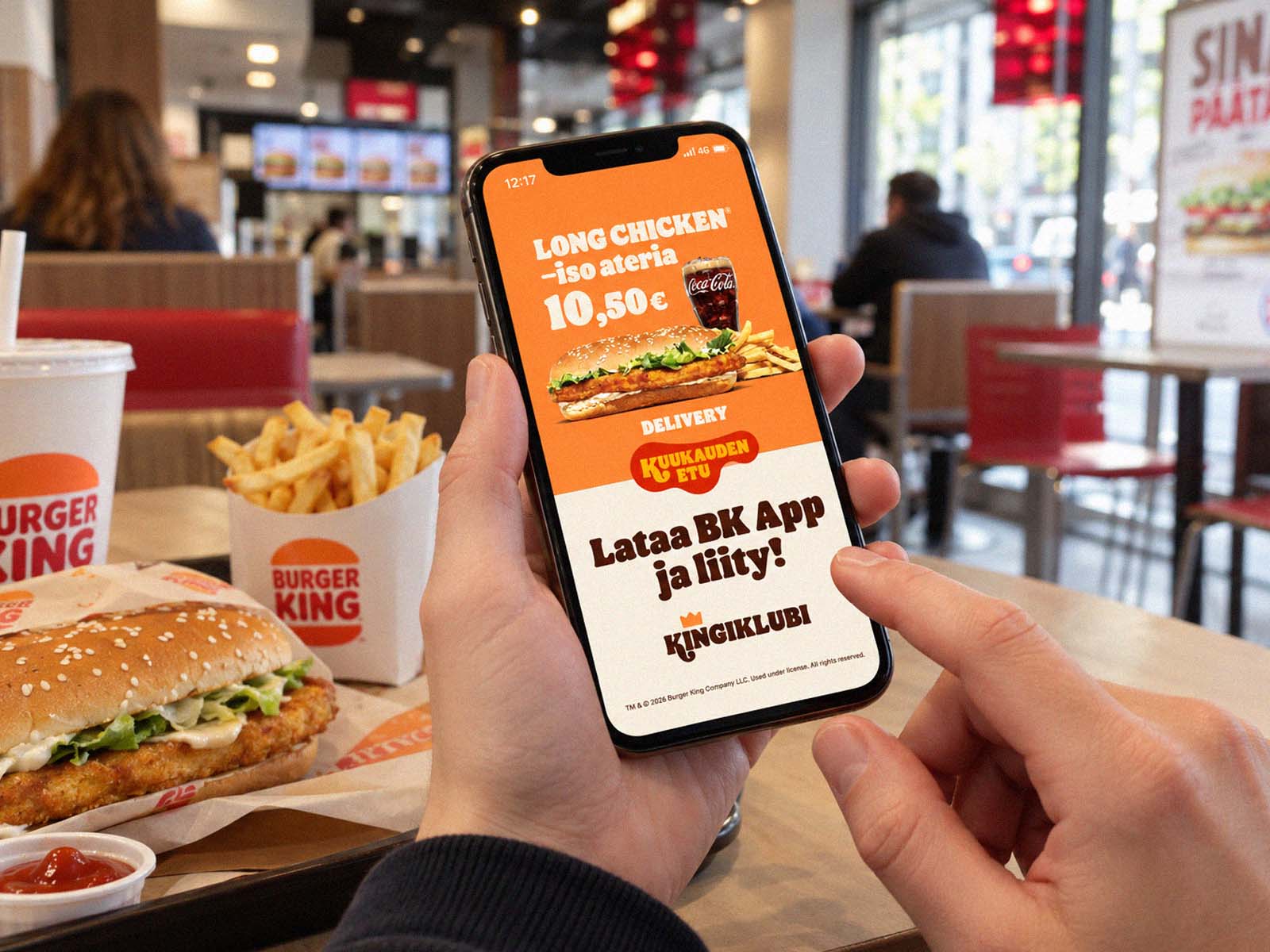 Burger King App coupon ad on a phone screen